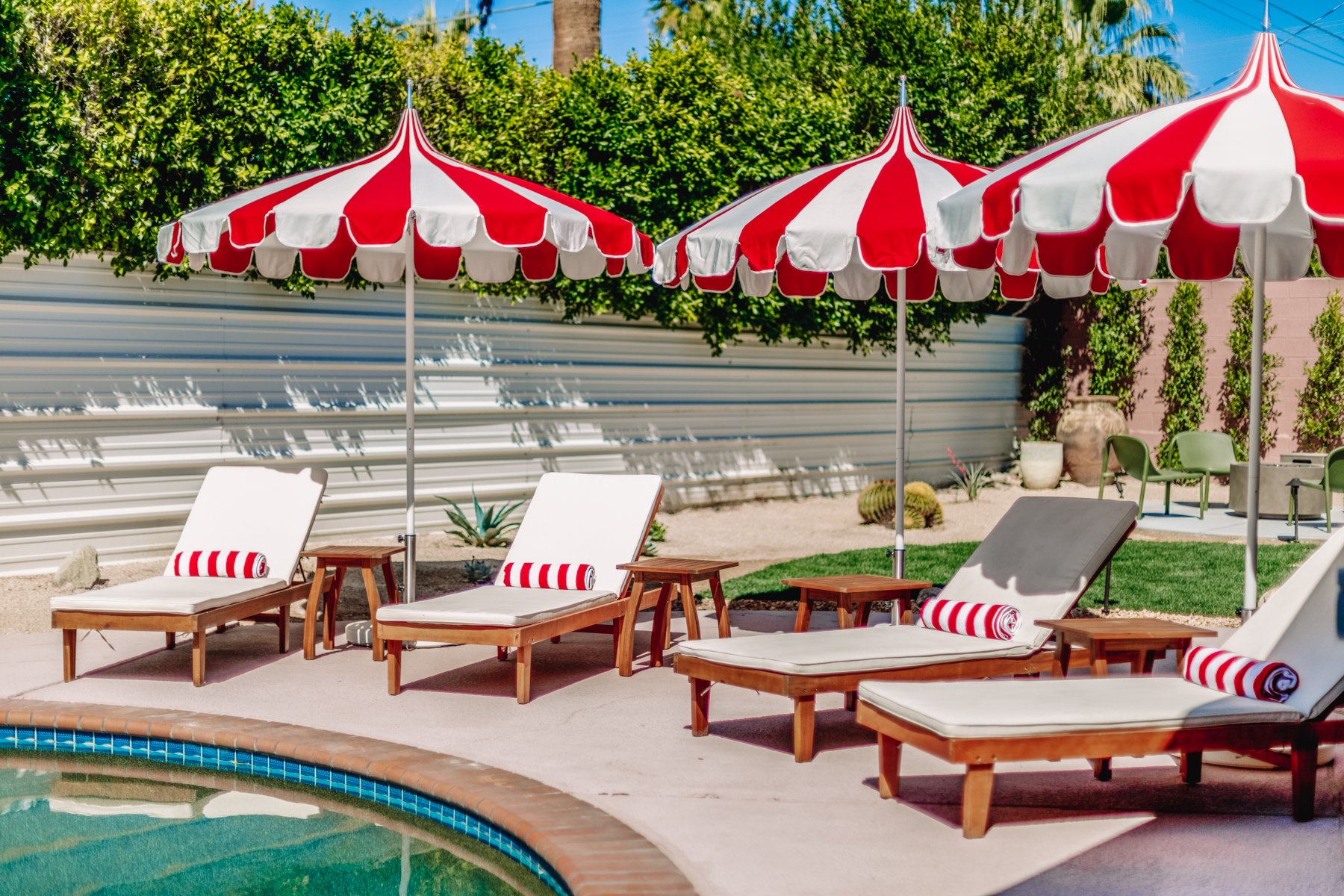 photo of lounge chairs near pool
