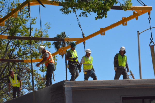 Men working on assembling a home